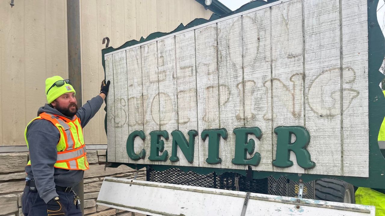 Workers removed a sign from the former Nelson Shopping Center hardware store in Bailey's Harbor. Photo courtesy Bailey's Harbor on Facebook.