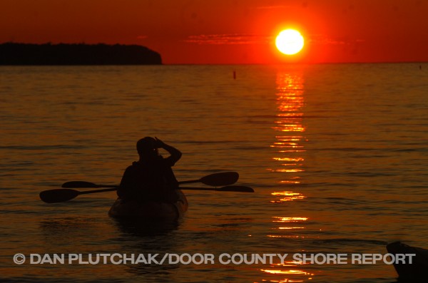 Kayaking under an Ephraim sunset. Commercial stock photography by Dan Plutchak/Door County Shore Report.