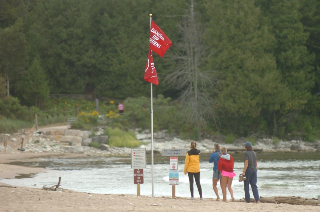 New riptide warnings have been installed at Whitefish Dunes State Park. Door County Shore Report photo by Dan Plutchak