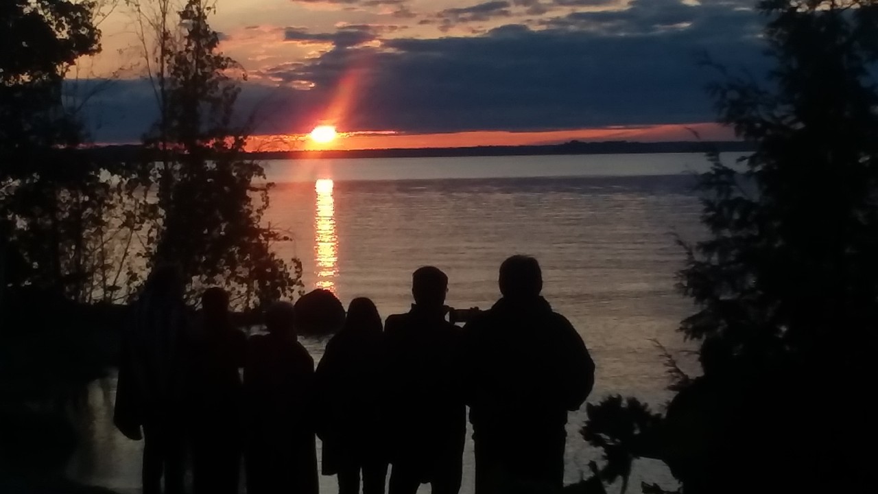 Visitors gather for sunset at the kayak launch in Door County's Peninsula State Park. Photo by Dan Plutchak/Door County Shore Report